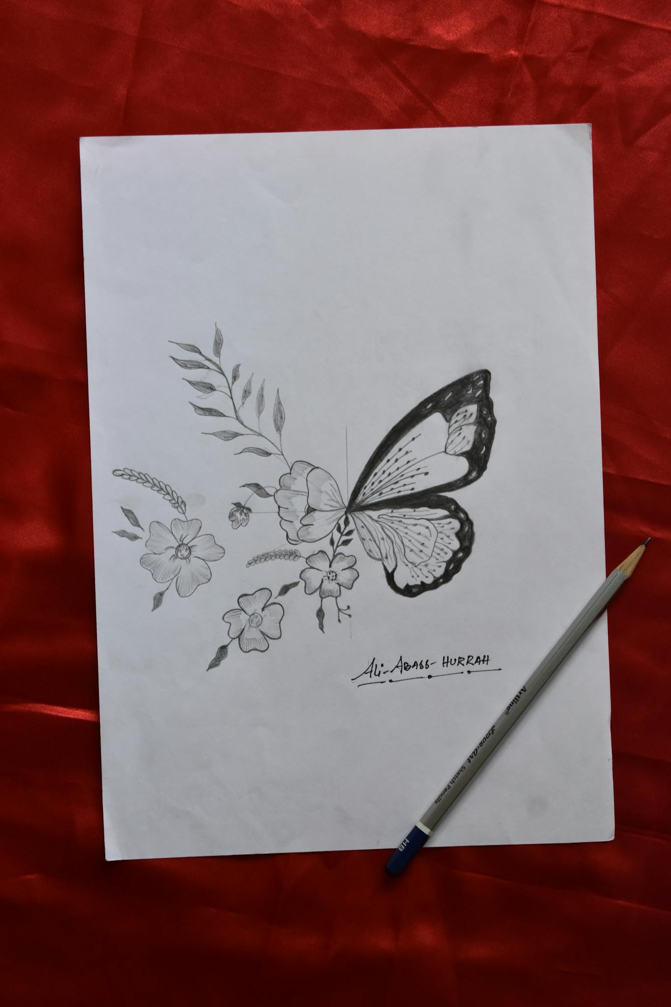 Black and white pencil sketch of a butterfly and flowers on a vertical paper background.