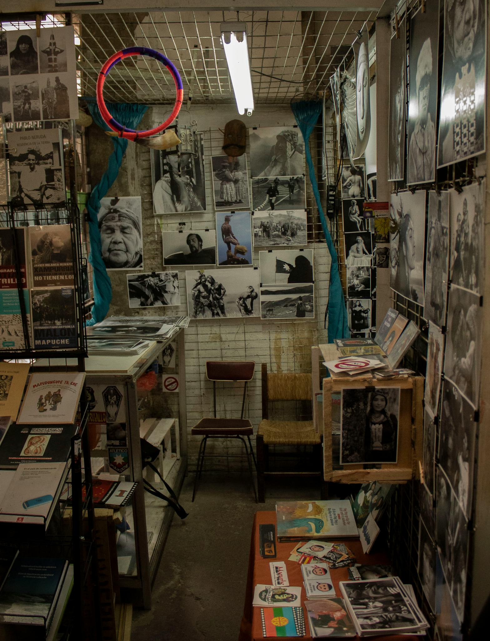 Explore a quaint shop filled with black and white art prints and vintage posters on display.